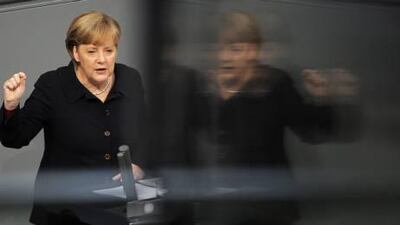 Angela Merkel makes a statement concerning the European debt crisis at the Bundestag in Berlin.