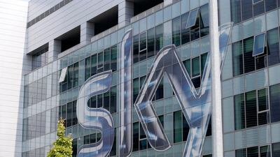 An auction will determine the outcome of the bidding war for Sky, says British regulator. AP