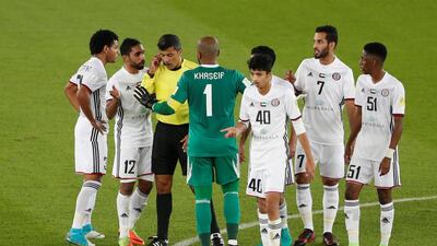 Referee Sandro Ricci with Al Jazira players after Real Madrid scored a goal that was eventually disallowed by VAR. Amr Abdallah Dalsh / Reuters