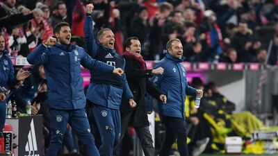 Bayern Munich interim coach Hansi Flick and sporting director Hasan Salihamidzic celebrate on the touchline. Reuters