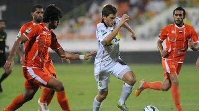 Ajman defenders try to stop Shikabala from forging ahead at the Saeed Stadium.