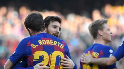 Barcelona's Sergi Roberto, left, after scoring against Getafe at Camp Nou. AFP