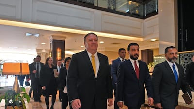 Iraqi Parliament Speaker Mohammed Al Halbousi, centre, with Secretary of State Mike Pompeo during the US official's visit to Baghdad on January 9, 2019. Reuters