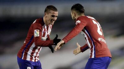 Yannick Ferreira-Carrasco, right, and Antoine Griezmann, left, scored the goals to return Atletico Madrid to the top of the Primera Liga table. Miguel Vidal / Reuters