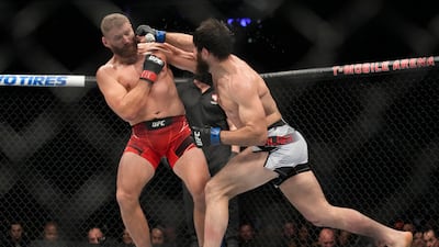 Magomed Ankalaev lands a right on Jan Blachowicz during their title fight at UFC 282. AP