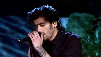Zayn Malik of One Direction performs at the 2014 American Music Awards at Nokia Theatre L.A. Live on November 23, 2014 in Los Angeles, California. Kevin Winter / Getty Images / AFP