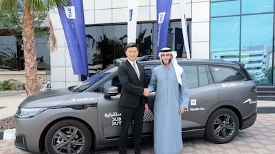 Mansoor Alfalasi, group chief executive of the Dubai Taxi Company, and Nan Yang, vice president of Baidu. Photo: DTC