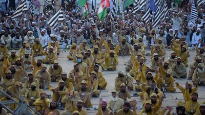 Supporters of JUI-F shout slogans during an anti-government march. AFP