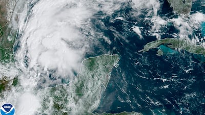 A satellite image shows Tropical Storm Nicholas in the Gulf of Mexico on Sunday. National Oceanic and Atmospheric Administration via AP