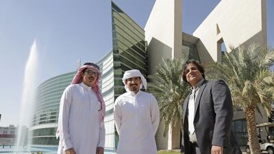 Left to Right, physically disabled students Saud Al Masslut and Abdullah Al Hashemi with Dr Zulfiqar Aslam, who developed the software, at UAE University in Al Ain. Jeffrey E Biteng / The National