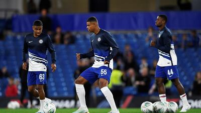 Chelsea youth team players Faustino Anjorin, Ian Maatsen and Marc Guehi during the warm up before the match against Grimsby. Reuters