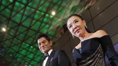 Actor Aaron Kwok and Kang arrive at the opening ceremony of the 18th Busan International Film Festival in South Korea in 2013. Getty Images