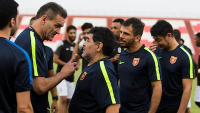 Fujairah, United Arab Emirates, July 15, 2017: Football legend Diego Maradona speaks with his assistant coach Luis Islas while being introduced as the new head coach of Fujairah football club of UAE's division one at the Fujairah stadium in Fujairah on July 15, 2017. Christopher Pike / The National Reporter: John McAuley Section: Sport Keywords: