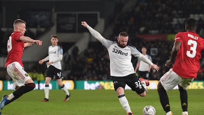 Wayne Rooney shoots for goal. AFP