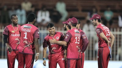 Sindhis leg-spinner Pravin Tambe, centre, celebrates the fall of another Kerala Knights wicket in the T10 League on Thursday in Sharjah.