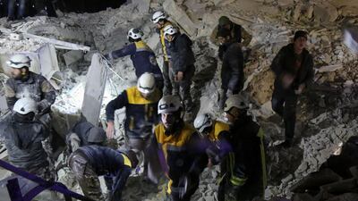 Syrian emergency personnel search for victims following an explosion in a rebel-held area of the northwestern city of Idlib on January 7. Zein Al Rifai / AFP