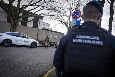 A military police officer stands guard near a Jewish school in Amsterdam, two days after an attack on the Jewish institution. AFP