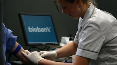 A nurse takes blood from a volunteer, to be stored in the UK Biobank. Getty Images