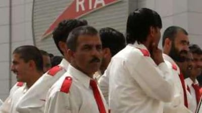 Taxi drivers park their cars in protest in front of the Dubai Taxi Agency main office.