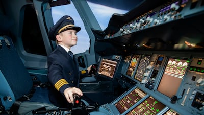 Plane-mad Jacob Newson said the highlight of his trip to Abu Dhabi was captaining the world's largest airplane. Photo: Etihad