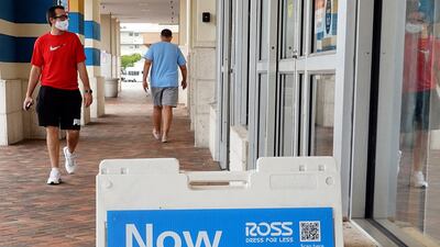 A Now Hiring sign near the entrance to a Ross department store in Hallandale, Florida. Unemployment in the US fell to 5.2% in August. Getty Images