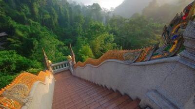 The Naga staircase at Wat Samnak Song Tham Pha Plong, a monastic centre set above the forests of Chiang Dao National Park in Chiang Mai province, Thailand.