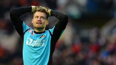 At 25, Simon Mignolet could be the long-term option to replace the veteran Pepe Reina. Andrew Yates / AFP