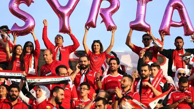 Syria supporters wait for the start of the match. AFP