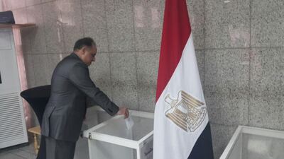 Wael Gad, the Egyptian ambassador to the UAE, is the first to vote at the embassy in Abu Dhabi.