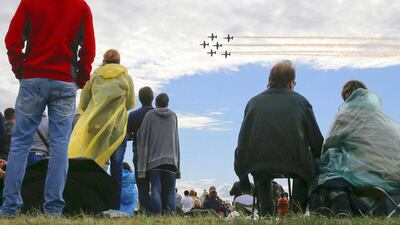 Spectators watch L-39 Albatros jet trainer aircrafts of Latvia’s Baltic Bees aerobatic team perform during the MAKS 2015. Maxim Shemetov / Reuters