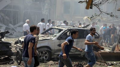 Lebanese television channels aired footage of the dead, of buildings with their fronts blown in and vehicles ablaze, as bystanders rushed to help the wounded. AFP Photo