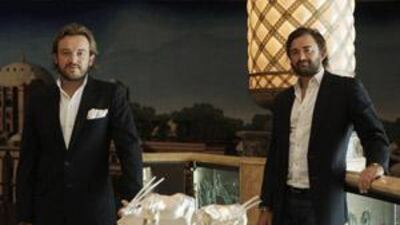 Alexander and (right) Forbes Mavros with their oryx sculptures at Emirates Palace.