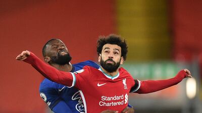 Liverpool striker Mohamed Salah is challenged by Chelsea defender Antonio Rudiger during the Premier League match at Anfield on Thursday, March 4. Chelsea won the match 1-0. Reuters