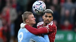 Manchester City striker Erling Haaland, left, vies with Liverpool defender Ronald Araujo. AFP