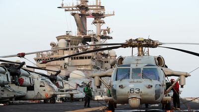 US aircraft are seen on the flight deck.