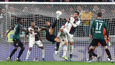 Federico Santander of Bologna FC performs an overhead kick during the Serie A match between Juventus and Bologna FC at Allianz Stadium in Turin, Italy. Getty Images