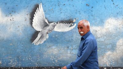 A peace mural on a street in Tehran. EPA