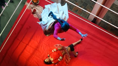 Yolandita, top, in action against Nayel La Bonita during a Cholita wrestling event in La Paz, Bolivia. Cholita fights, featuring women in traditional skirts, are a well-known cultural and sporting spectacle. EPA