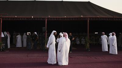 Members of Sultan Bin Zayed Al Nahyan’s entourage congregate around his majlis.