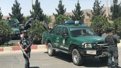 Afghan policemen stand guard amid an attack and gunfire in Kabul, Afghanistan on May 30, 2018. Mohammad Ismail / Reuters