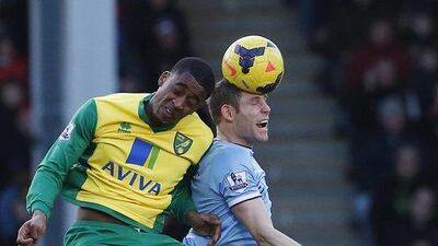 Norwich City's Leroy Fer, left, challenges Manchester City's James Milner during their English Premier League match at Carrow Road on Saturday. The match ended in a scoreless draw. Suzanne Plunkett / Reuters