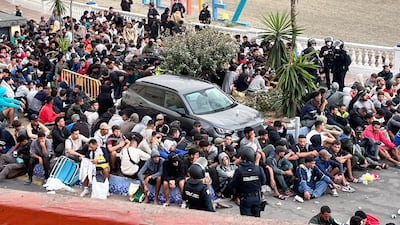 Migrants at Benitez Beach. EPA