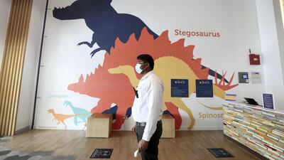 A staff member checks temperatures at OliOli. Chris Whiteoak / The National