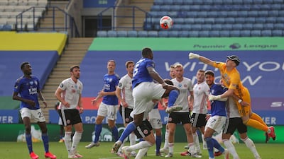Sheffield United goalkeeper Dean Henderson attempts to punch clear. AFP