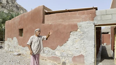 Hasan Al Yamahi laments the poor condition of his house in the mountain village of Al Taween in Fujairah. The two-room dwelling, which he shares with his wife, son and daughter, is typical of the area with a metal roof, basic pebble flooring and a separate outdoor kitchen. Jeffrey E Biteng / The National