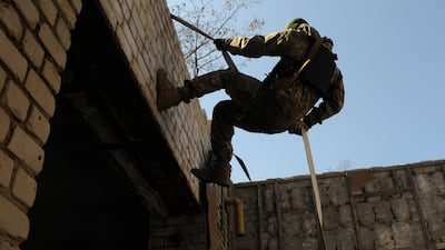 A Ukrainian serviceman attends a training session in Kharkiv outskirts, Ukraine. AP