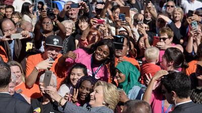 Democratic US presidential nominee Hillary Clinton takes a selfie during an Iowa Democratic party vote rally on September 29, 2016, in Des Moines, Iowa. Brendan Smialowski / Agence France-Presse