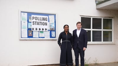 Conservative leader Kemi Badenoch and her husband Hamish cast their votes at Clavering Village Hall in Saffron Walden. PA