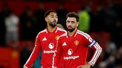 Manchester United's Bruno Fernandes, right, looks dejected after the 3-2 defeat to Brighton in the third round of the League Cup. Reuters