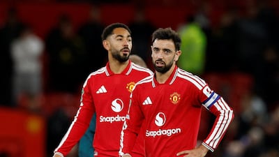 Manchester United's Bruno Fernandes, right, looks dejected after the 3-2 defeat to Brighton in the third round of the League Cup. Reuters